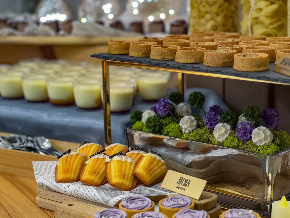 Madeleines, dessert cups and flowers at a Zuo LOHERB cocktail reception